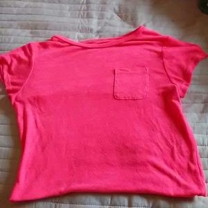 A bright pink crop top